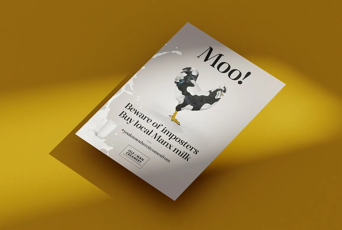 An angled print poster mockup for Isle of Man Creamery displayed on a bold gold/mustard yellow background. The poster features a rooster with the headline "Moo!", the text "Beware of imposters, Buy local Manx milk," the hashtag #youknowwhereitcomesfrom, and the Isle of Man Creamery logo.